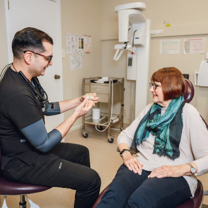 Dentist talking to patient