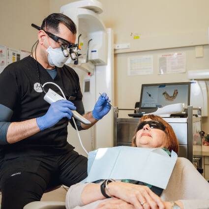 Dentist working with patient