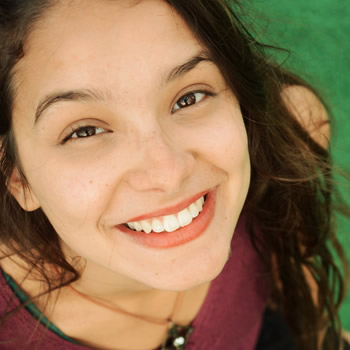 Woman smiling with gleaming teeth