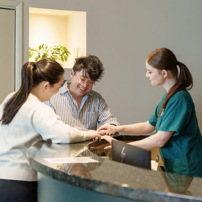 our dentist and team talking with a patient