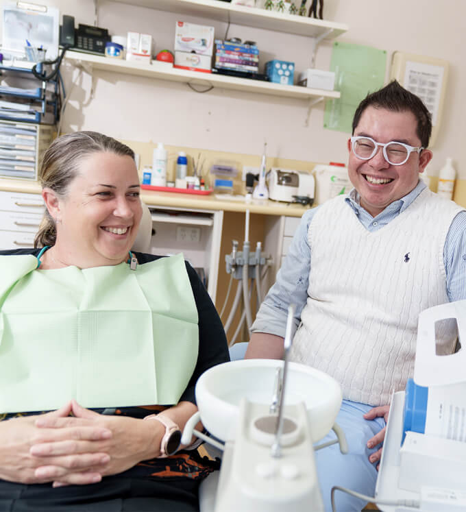 Patient and Dentist laughing