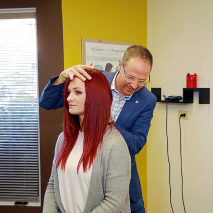 adjusting-woman-red-hair