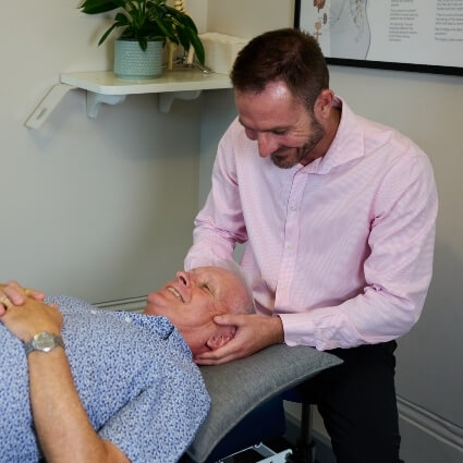 Dr Steve adjusting patients neck