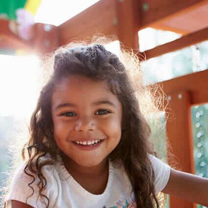 Girl smiling on playset