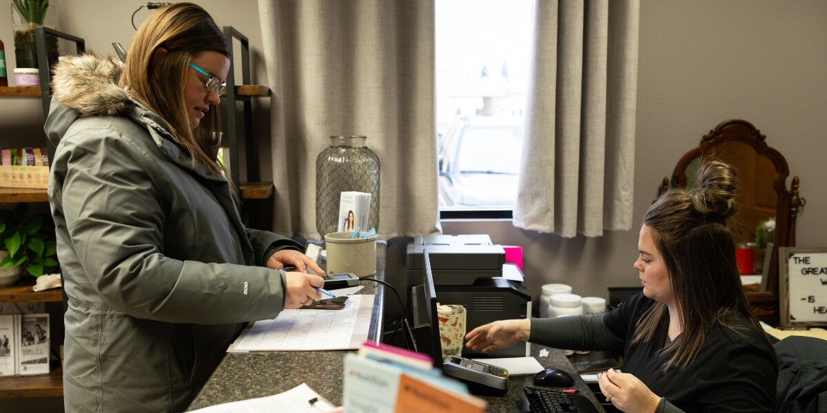 Minot patient checking in at Klein Chiropractic & Wellness, PC