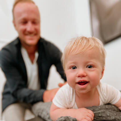 Dr. Jason adjusting a blonde boy