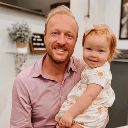 Dr. Jason holding a little girl