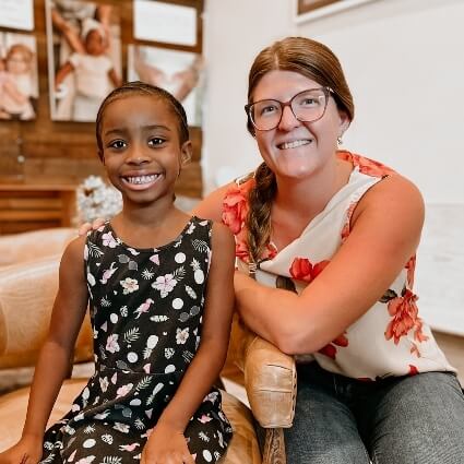 Holly Springs chiropractor Dr K with a young girl
