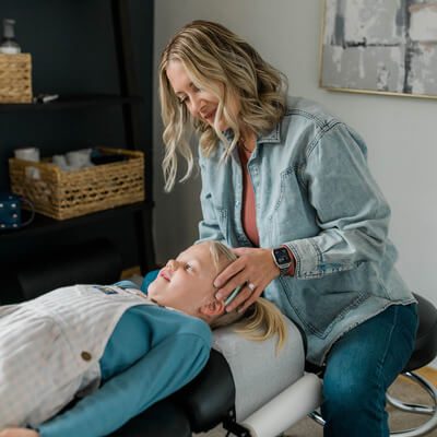 girl lying on adjustment table