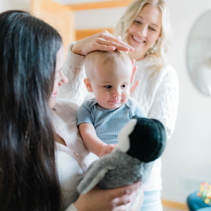 Chiropractor adjusting toddler