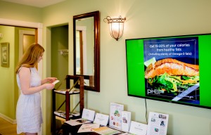 woman reading flyer about real salmon 