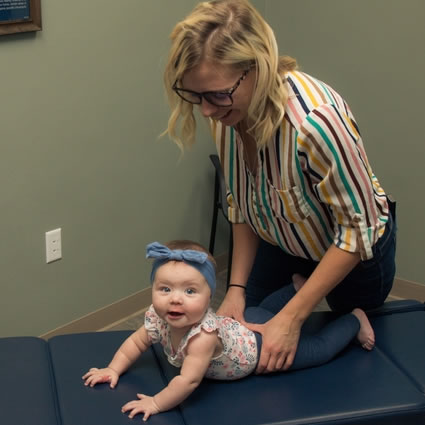 Adjusting baby on table