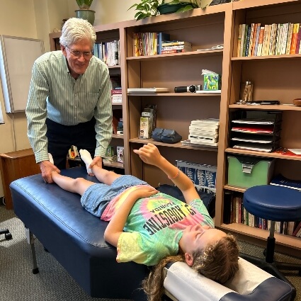 doctor adjusting kid patient