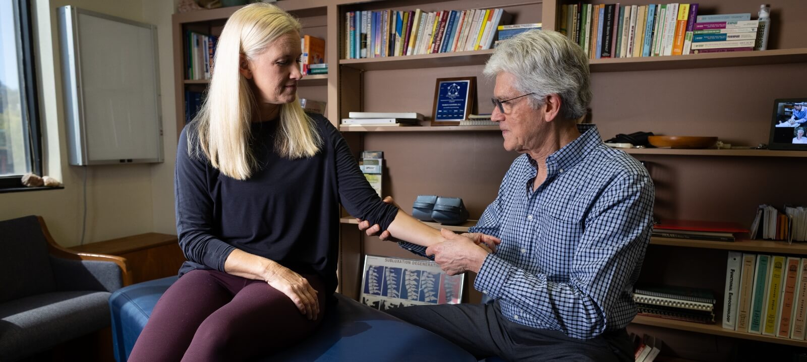 doctor adjusting patient