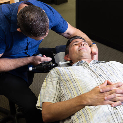 Using Activator on man's neck