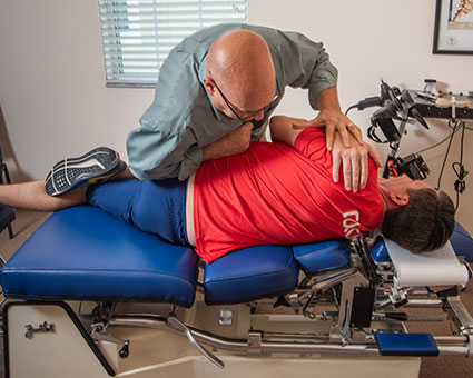 Adjusting patient's back