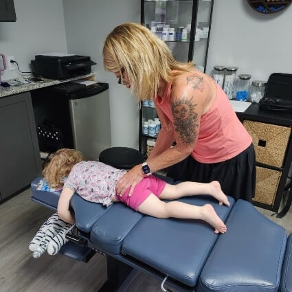 Dr Caplan adjusting kids hids