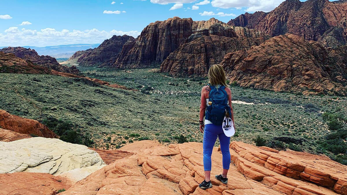 Dr. Caplan standing on mountains