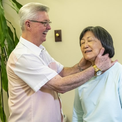 Dr. Shows adjusting womans neck