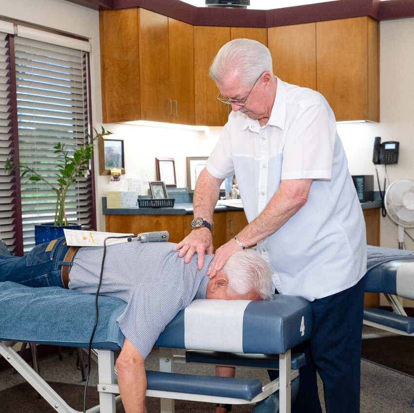 Dr Shows adjusting patients back