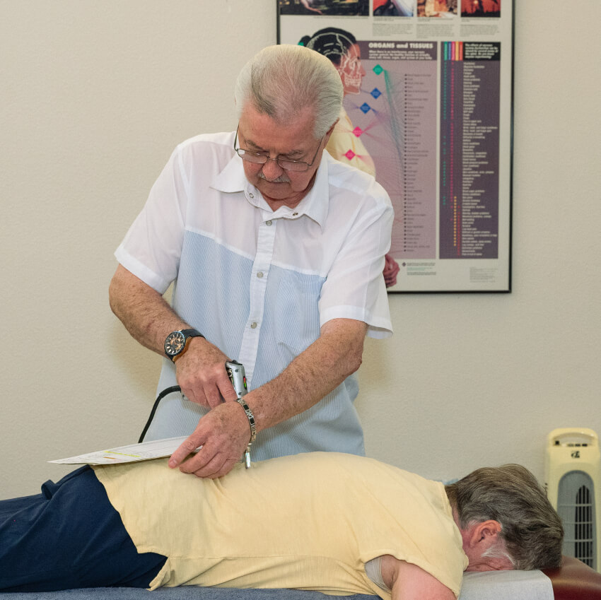 Dr Shows adjusting patients back
