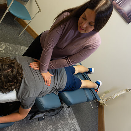 Doctor at Spurback Family Chiropractic working on patient's back