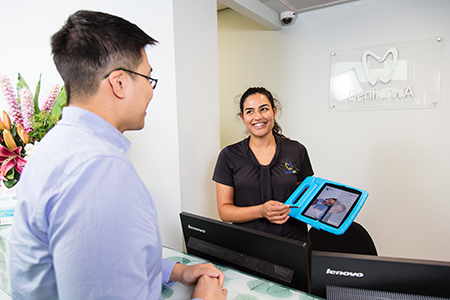 Receptionist chatting with new patient