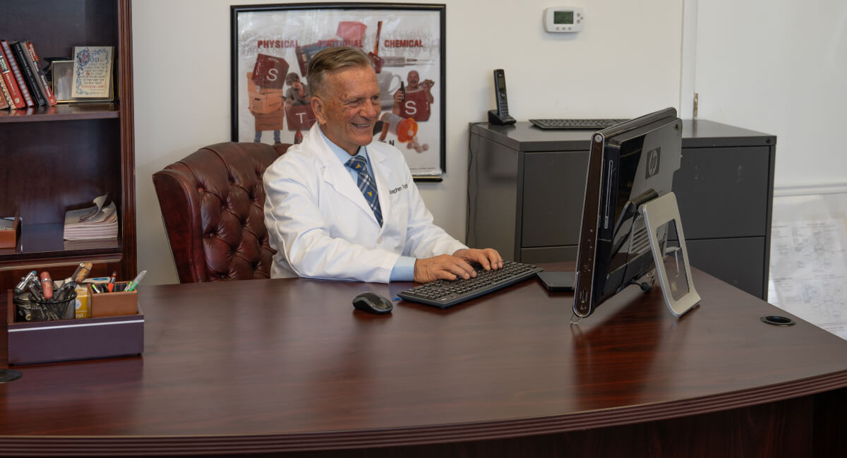 Morgantown chiropractor Dr. Toth sitting at his desk