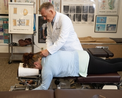 Chiropractic Care Female patient back adjustment