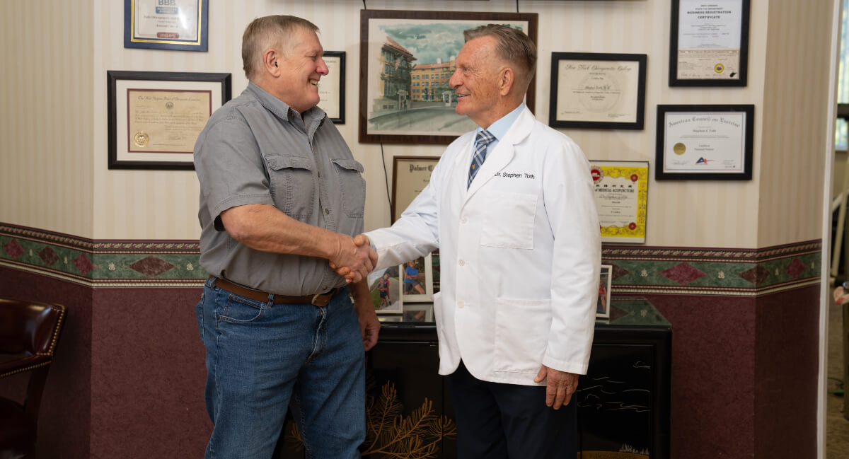 Morgantown chiropractor shaking patient's hand