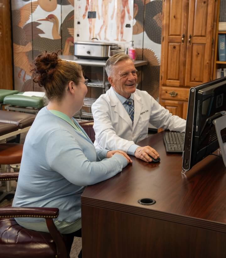 Morgantown patient in a chiropractic consultation at Toth Chiropractic and Wellness