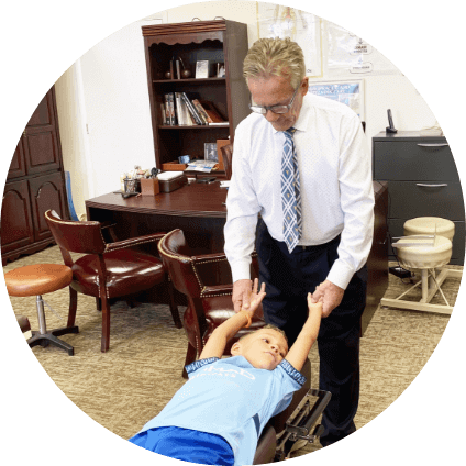 doctor adjusting kid patient