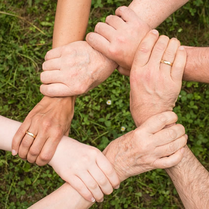 group of people holding hands