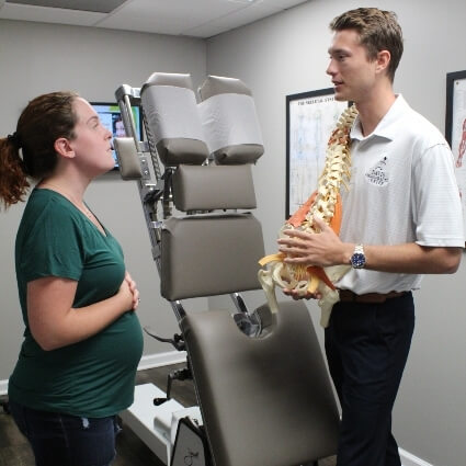 Pregnant Woman in consultation at Davis Chiropractic Center