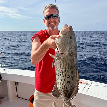 Dr. Gary holding a large fish