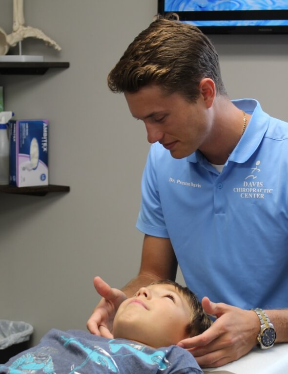 Chiropractor adjusting patient