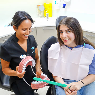 Monica Ramzy with patient and mouth model