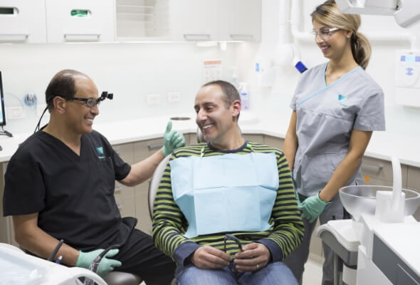 Willsmere Dental team talking with a smiling patient