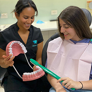 Monica Ramzy with patient brushing