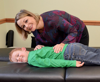 Dr. Alison Cummings with pediatric chiropractic patient.