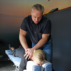 Alex Oxford with massage client