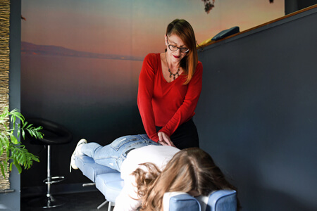 Massage therapist with client