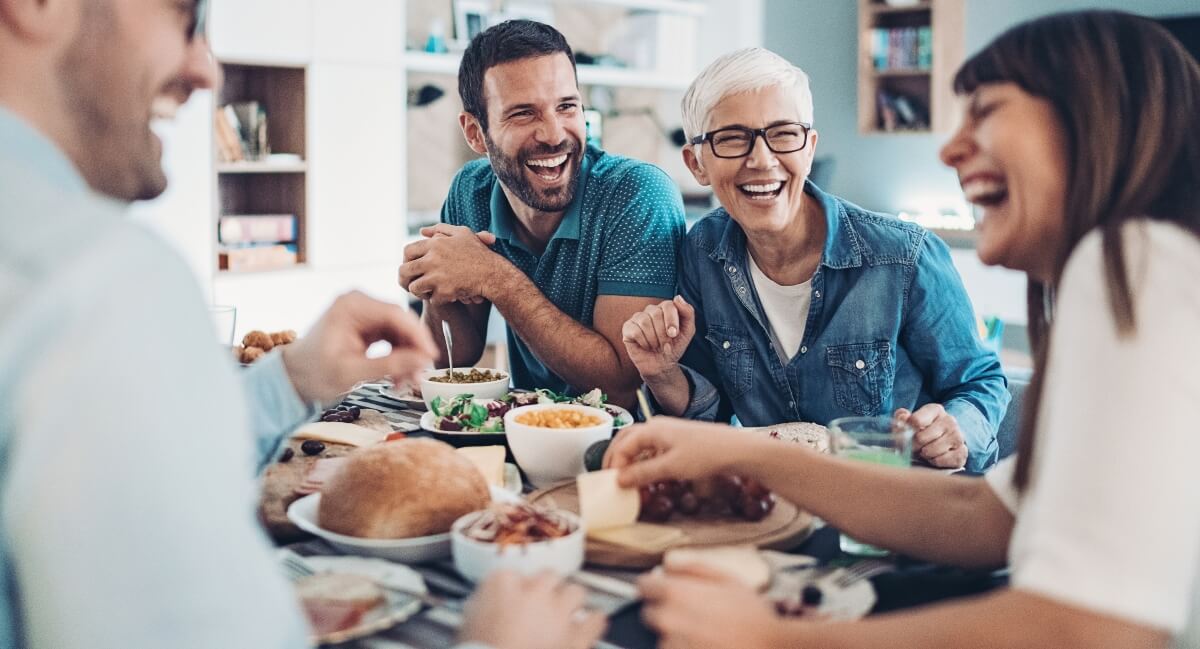 Happy people at the dinner table