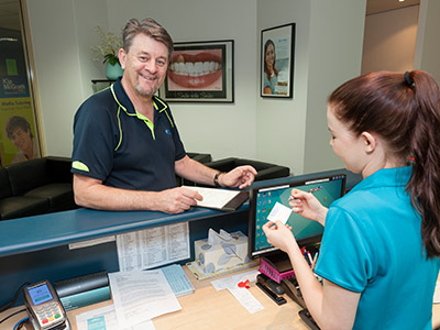 new patient welcomed by receptionist 