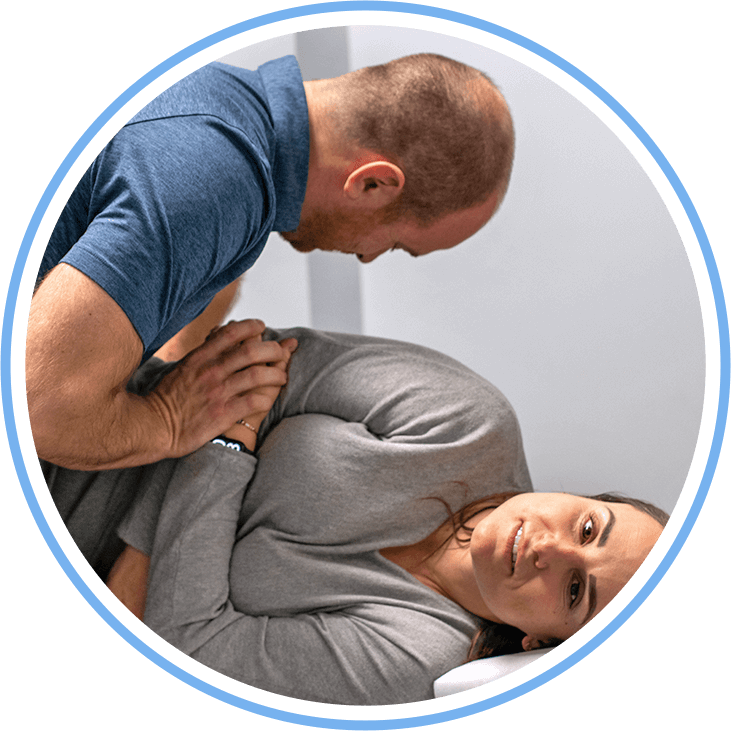 Doctor adjusting patient on side