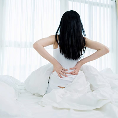 woman wake up back pain