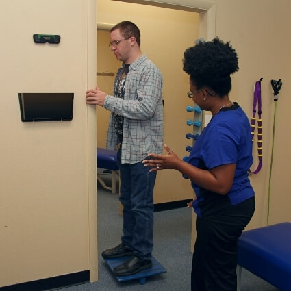 patient on a balancing device