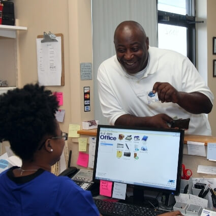 patient talking to our front desk staff