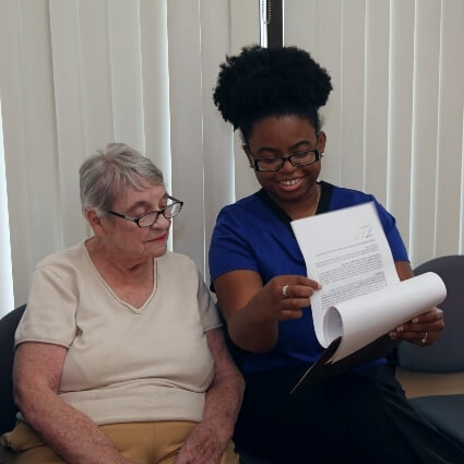patient and staff reviewing our forms