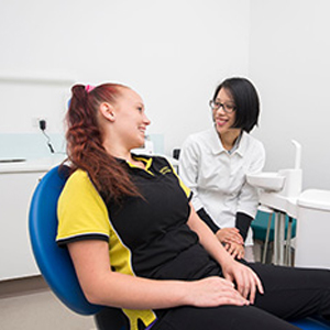 A new patient patient at Flagsmile Dental put at his ease by Dr Ann Chen